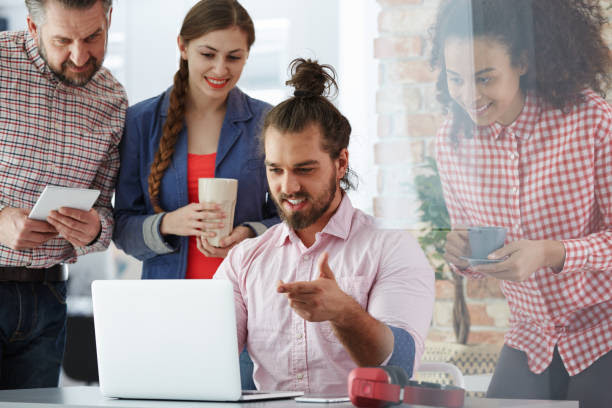 The Best Facebook Marketing Tips For Online Businesses Workers of advertising agency working on new facebook campaign