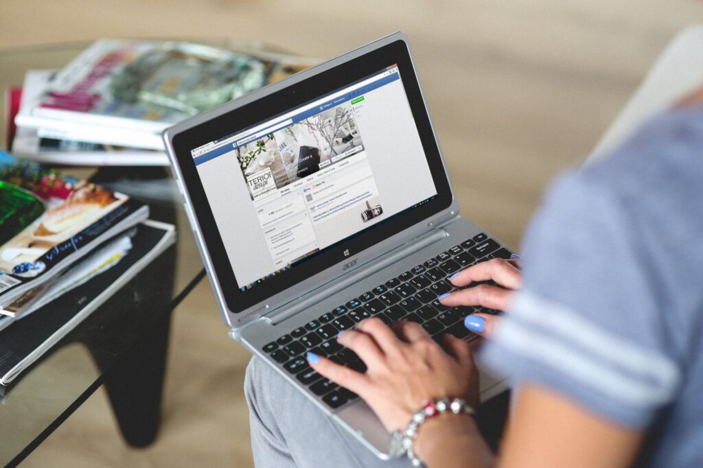 Finding The Best Social Media Management Tools Digital marketer creating Facebook campaign using social media management tools